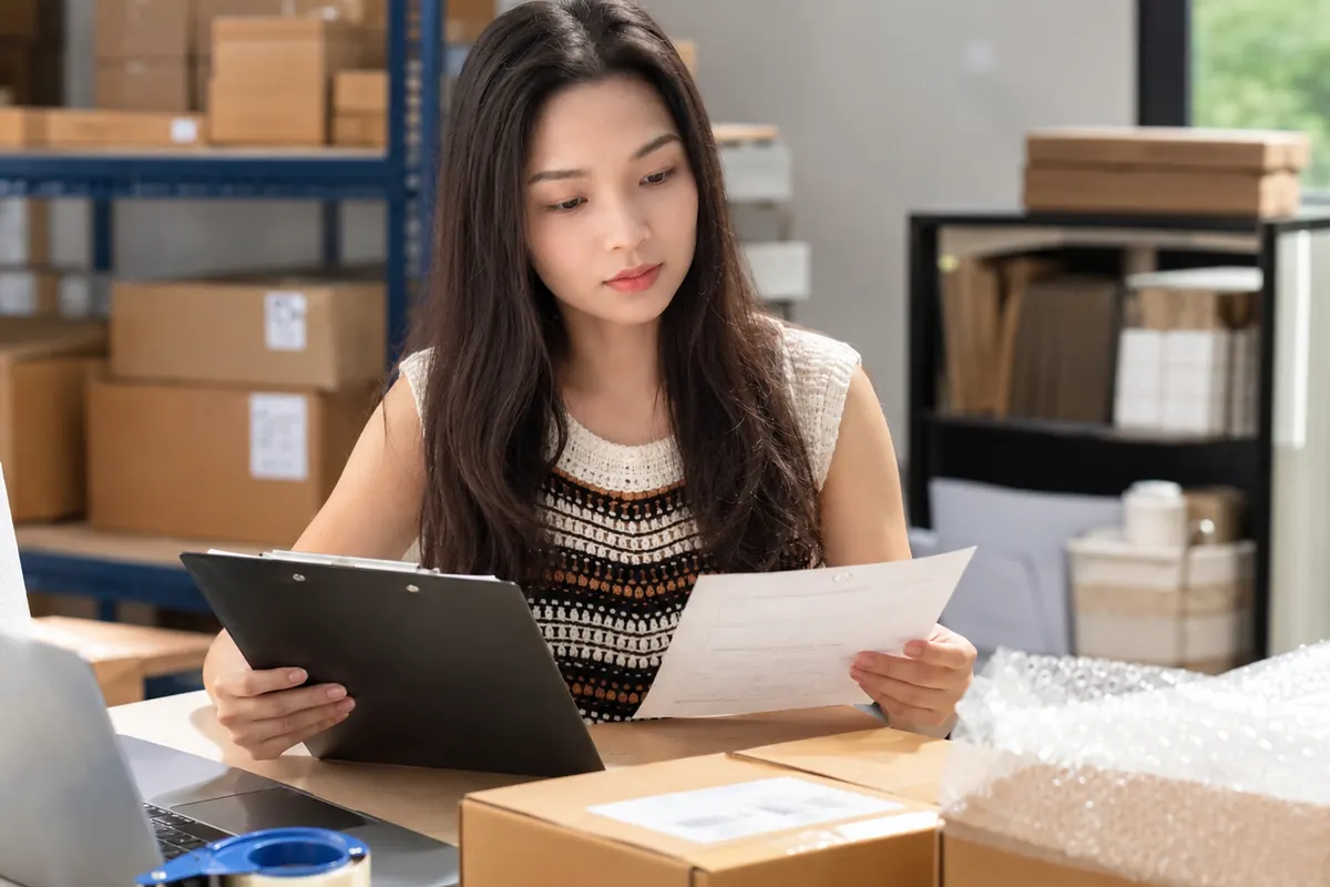 Kelsy checking product inspection details before shipment
